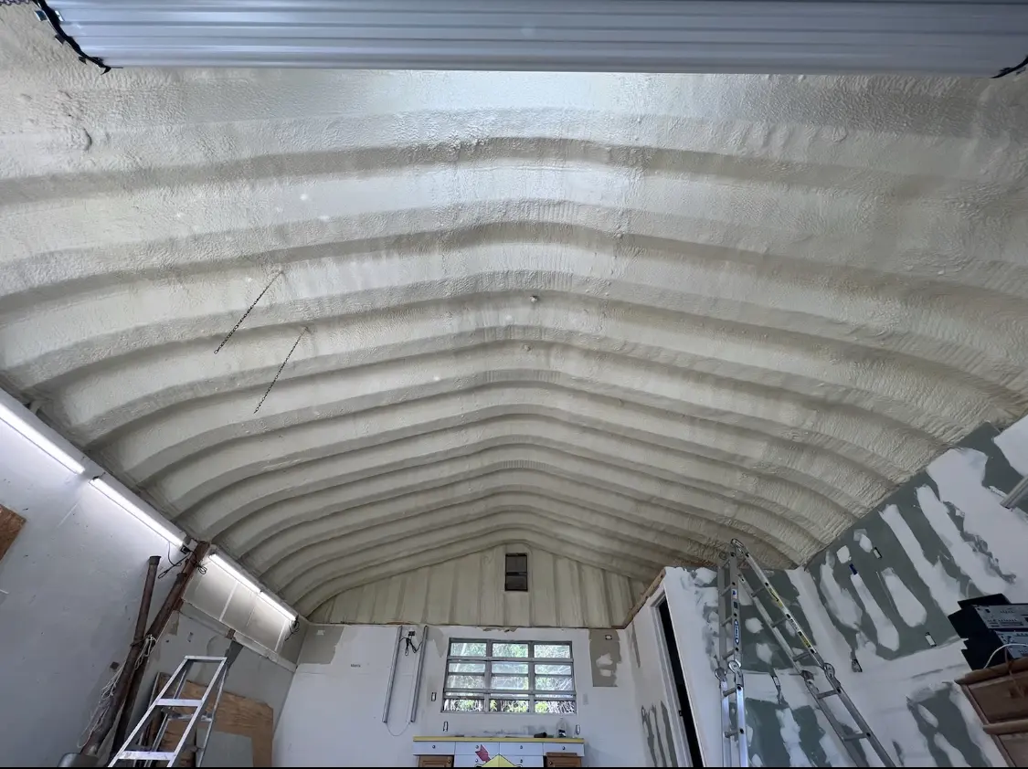 Spray polyurethane foam applied to the underside of a metal roof deck in Warr Acres